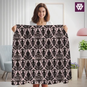 A young woman holding Fallen Angel Custom Printed Blanket | Baroque Lilac Lace Pattern in her hands stretched to make the blanket pattern clearly visible, standing a in bright and pastel decorated feminine living room.